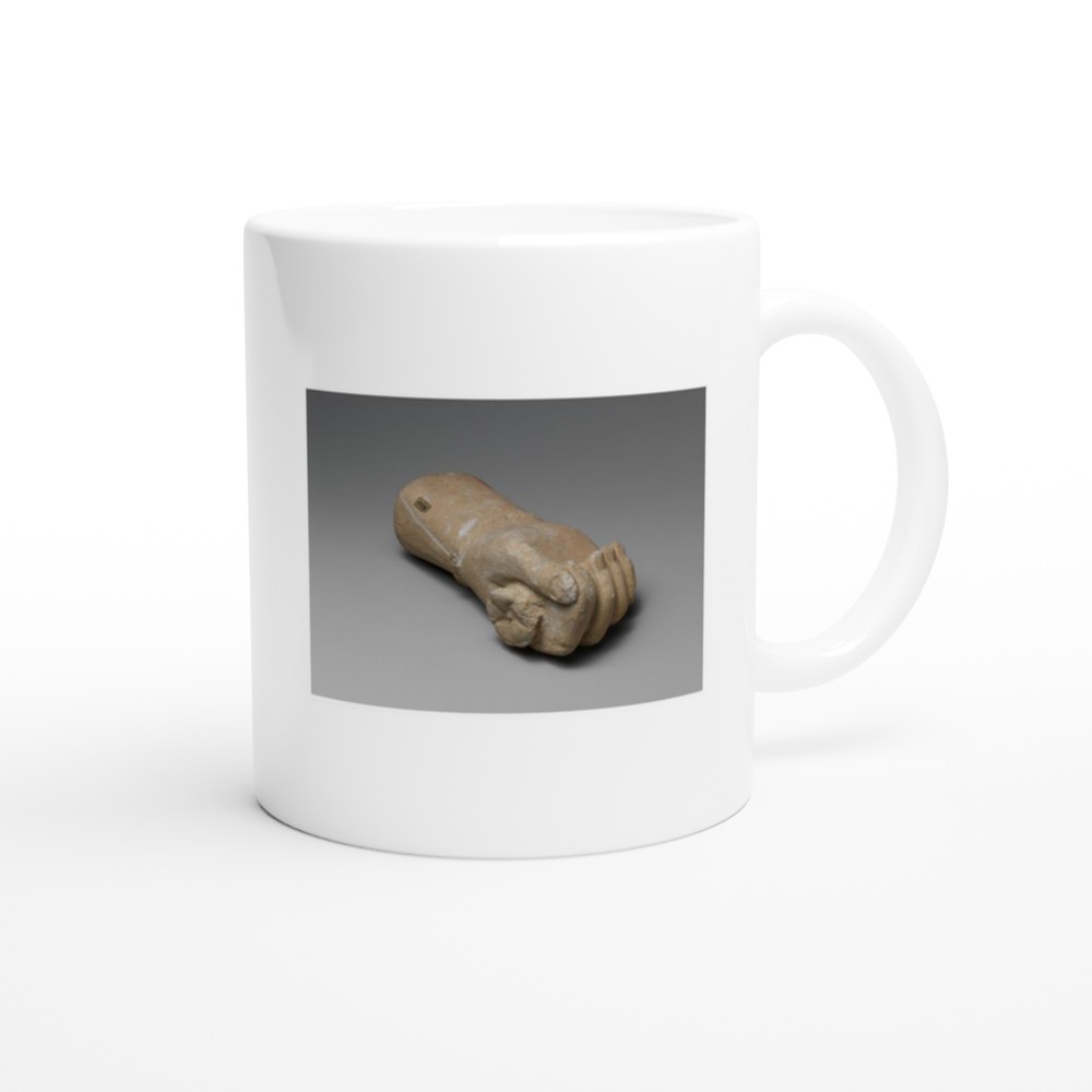 Limestone statue fragment of a right hand with a bracelet, holding a flower